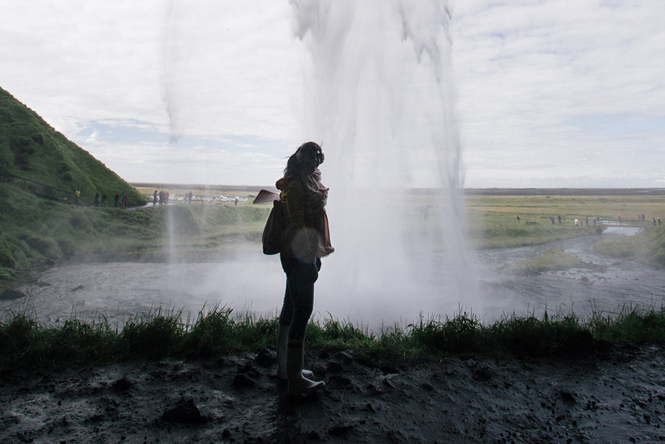 walking behind a waterfall in Iceland 
