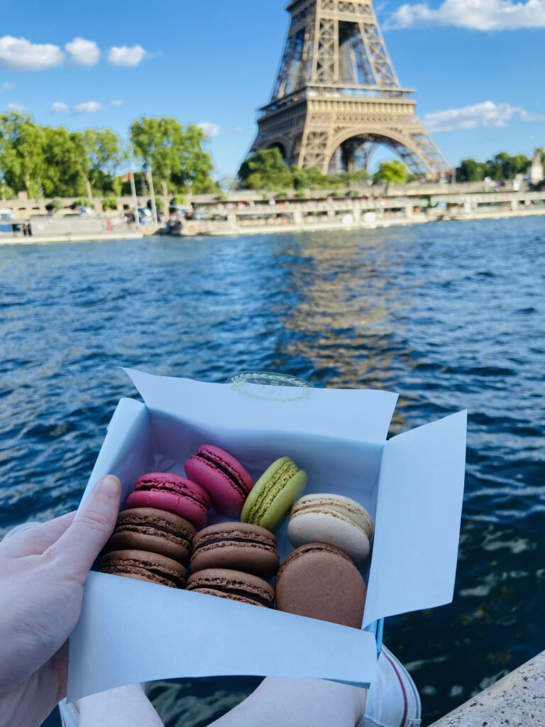 eating macarons at the Eiffel Tower